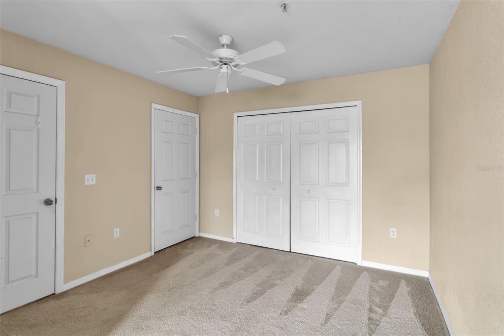 5511 Rosehill Road, Unit 203 Sarasota, FL 34233 - Photo 26 of 49 a view of an empty room with a chandelier fan