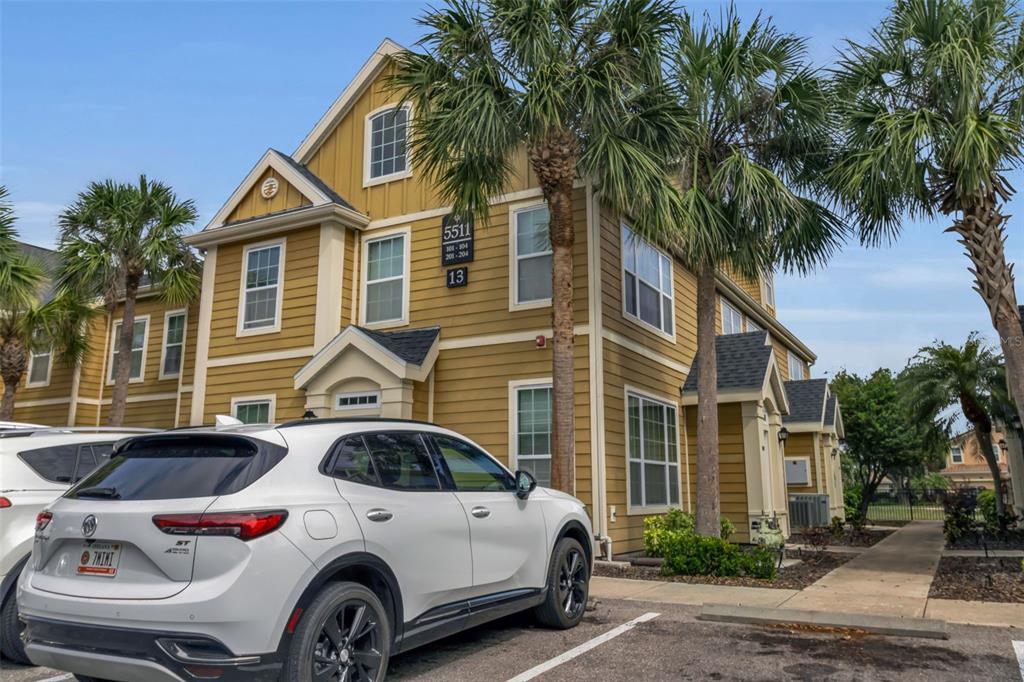 5511 Rosehill Road, Unit 203 Sarasota, FL 34233 - Photo 3 of 49 a front view of a house with parking space