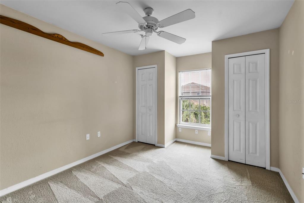 5511 Rosehill Road, Unit 203 Sarasota, FL 34233 - Photo 31 of 49 a view of a big room with windows and chandelier fan