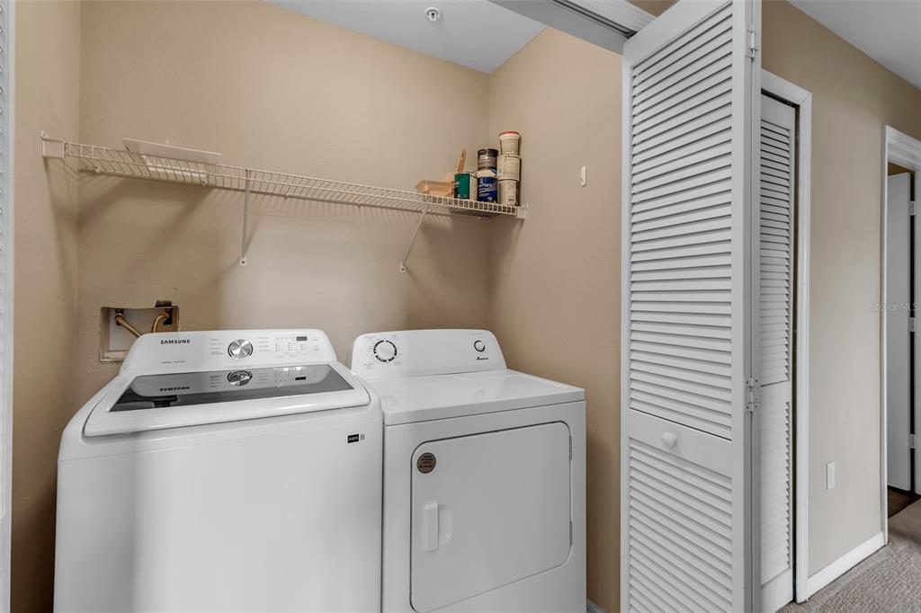 5511 Rosehill Road, Unit 203 Sarasota, FL 34233 - Photo 32 of 49 a utility room with dryer and washer