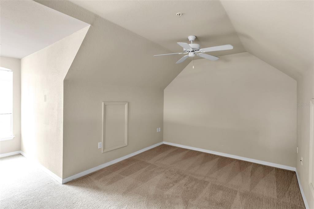 5511 Rosehill Road, Unit 203 Sarasota, FL 34233 - Photo 34 of 49 an empty room with a ceiling fan and a window