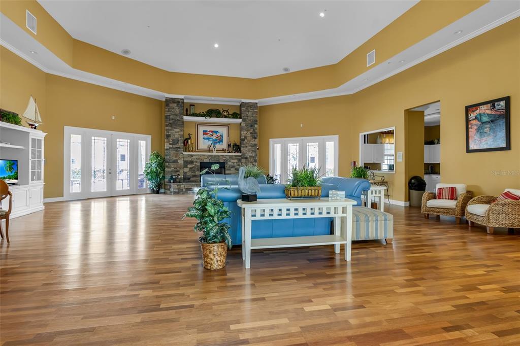 5511 Rosehill Road, Unit 203 Sarasota, FL 34233 - Photo 38 of 49 a view of a living room or kitchen with furniture wooden floor and a table
