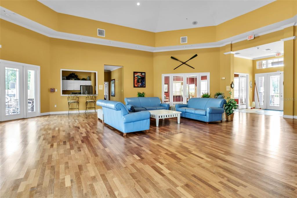 5511 Rosehill Road, Unit 203 Sarasota, FL 34233 - Photo 39 of 49 a living room with furniture and a wooden floor