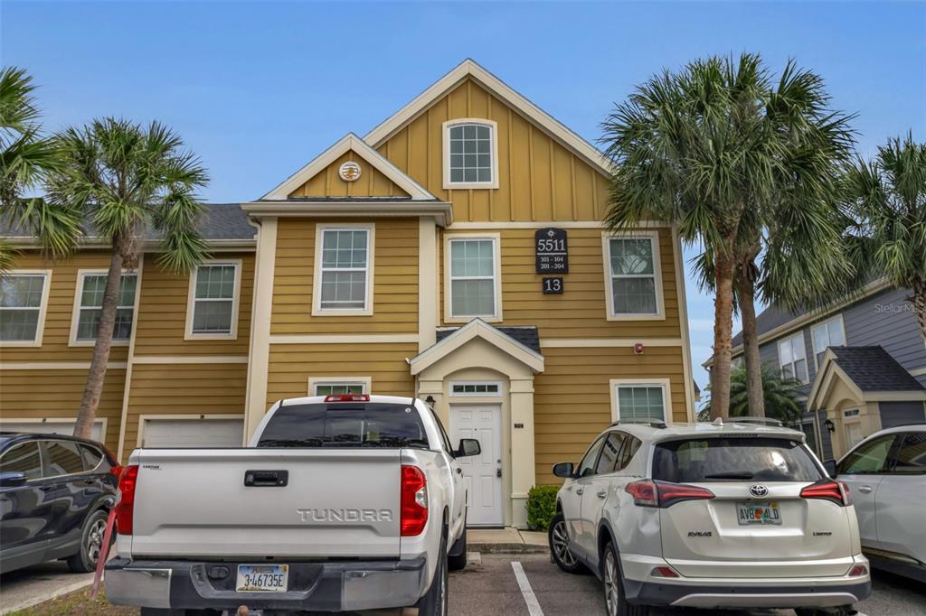 5511 Rosehill Road, Unit 203 Sarasota, FL 34233 - Photo 4 of 49 a front view of a house with a yard