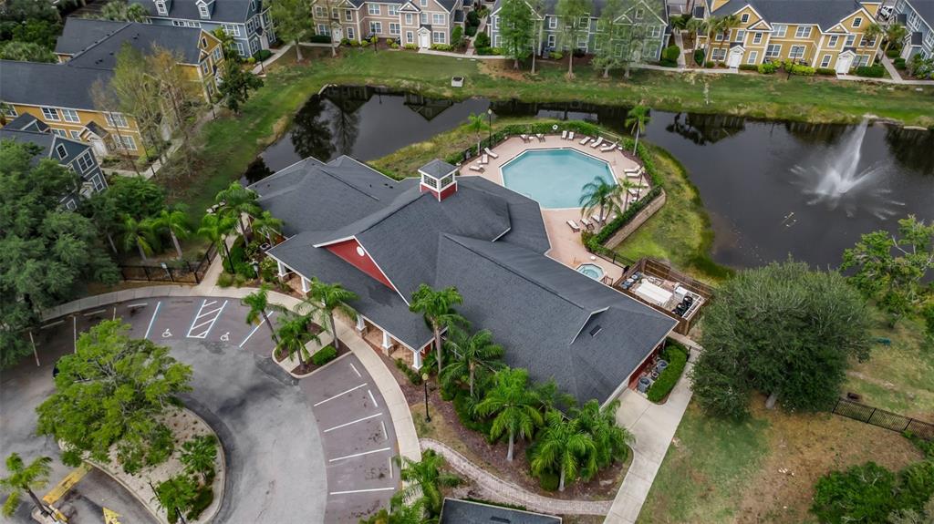 5511 Rosehill Road, Unit 203 Sarasota, FL 34233 - Photo 45 of 49 an aerial view of a house with garden space and lake view