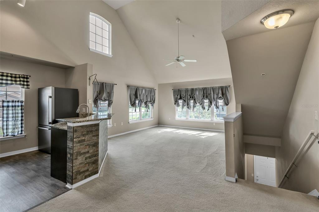 5511 Rosehill Road, Unit 203 Sarasota, FL 34233 - Photo 8 of 49 a view of living room with furniture and a flat screen tv