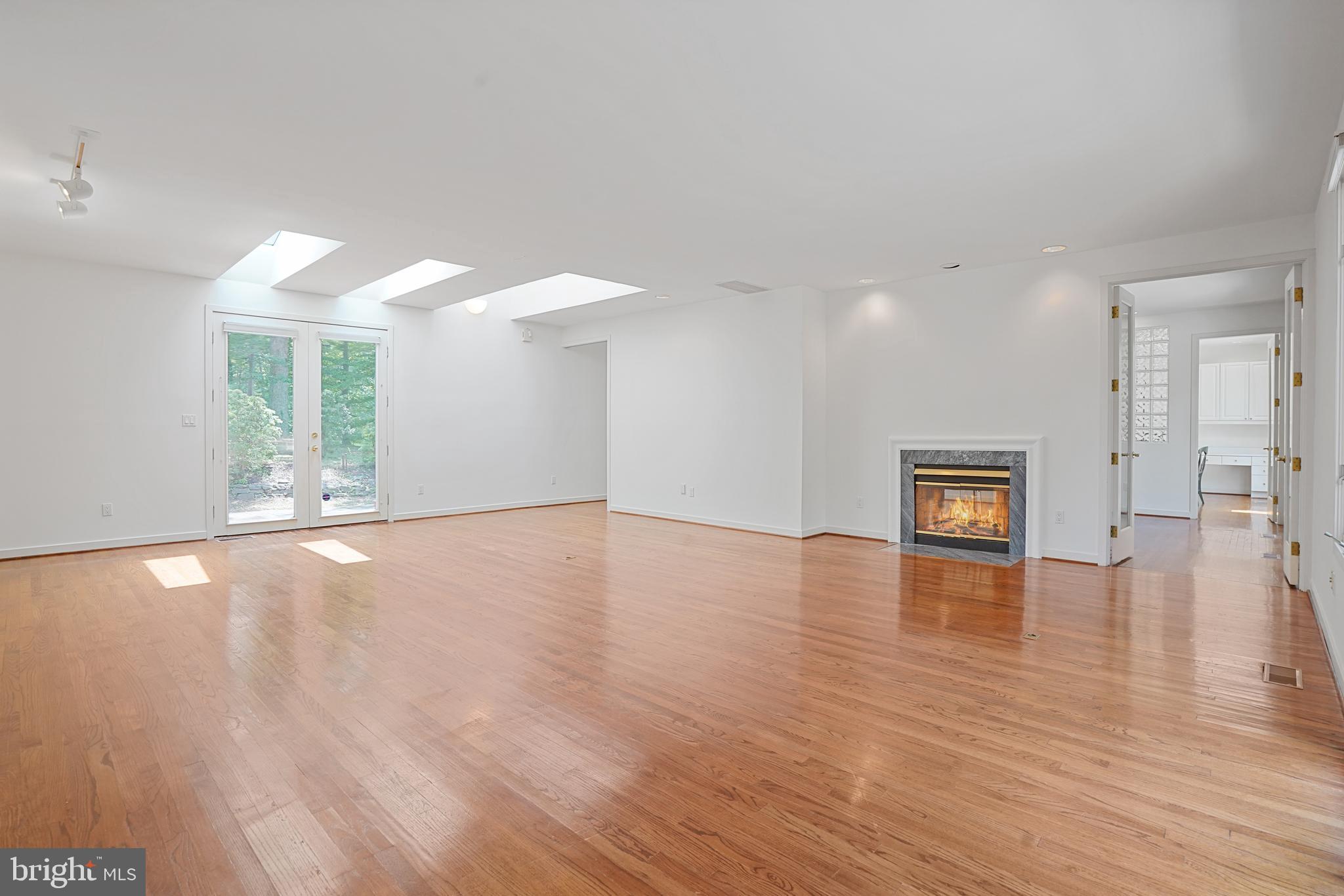 926 Saigon Road McLean, VA 22102 - Photo 11 of 54 Double-sided Fireplace b/w Living & Dining Room