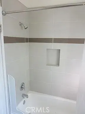 a bathroom with a sink and mirror with toilet