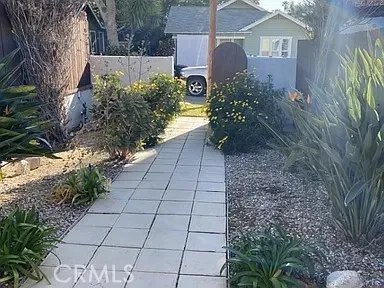 a view of a door and wooden fence