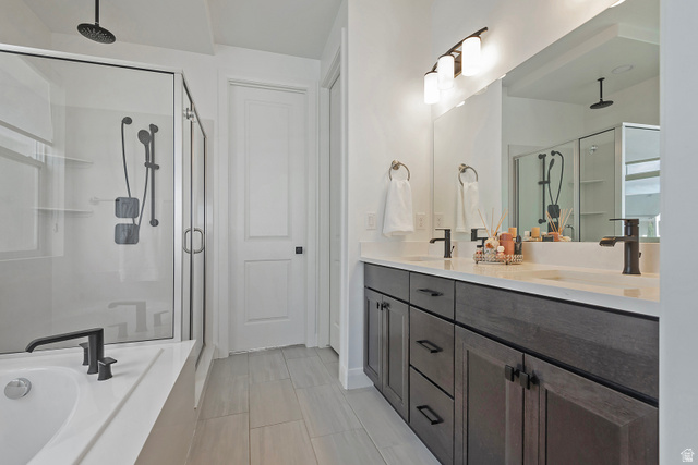 11694 Engelmann Drive Draper, UT 84020 - Photo 23 of 41 Bathroom featuring a shower stall, double vanity, and a garden tub