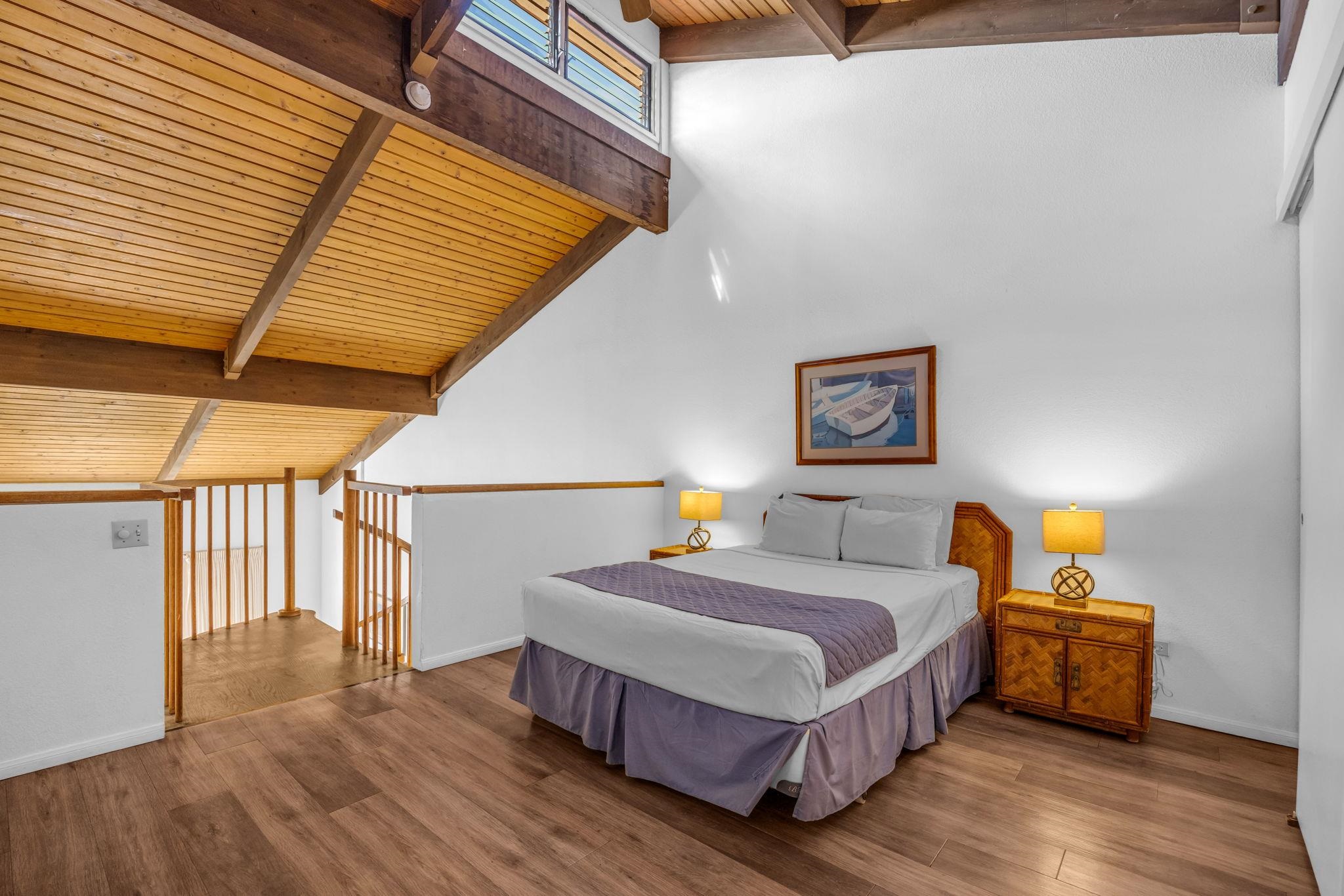 2695 South Kihei Road, Unit 3403 Kihei, HI 96753 - Photo 17 of 41 a bedroom with a bed and wooden floor