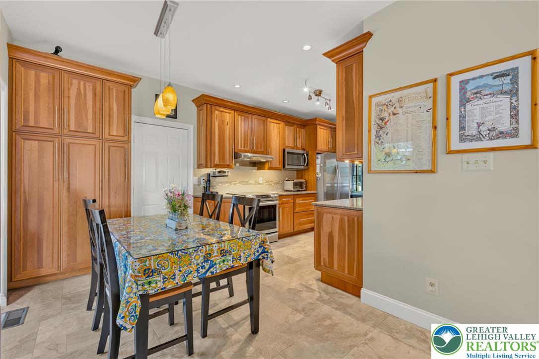 1702 Red Bud Road Quakertown, PA 18951 - Photo 19 of 68 The well-appointed kitchen offers ample cabinetry, modern appliances, and a convenient eat-in dining area.
