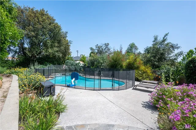 a view of a bench in a backyard