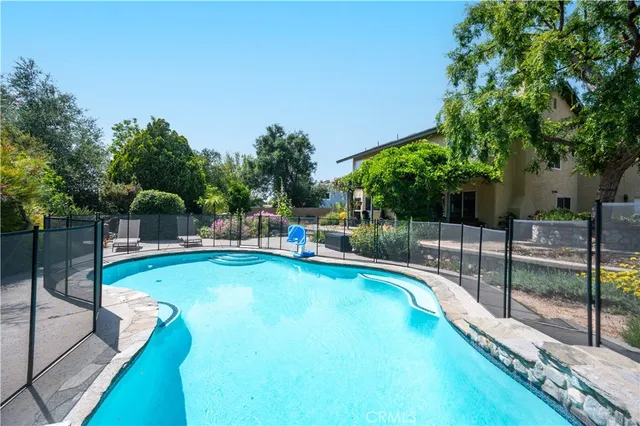 a view of a swimming pool with a patio