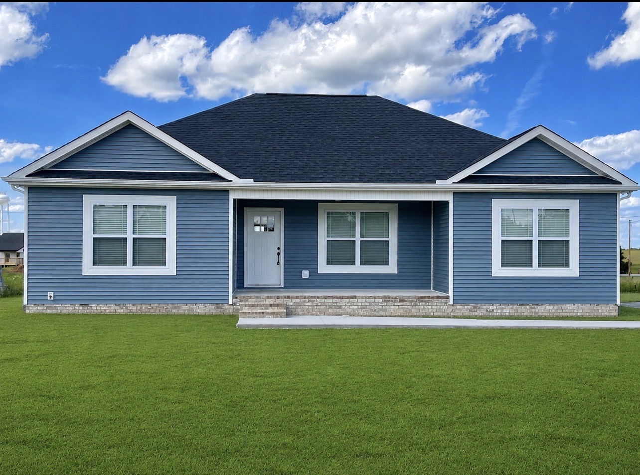 104 Donald Road Lafayette, TN 37083 - Photo 1 of 22 a front view of a house with a garden