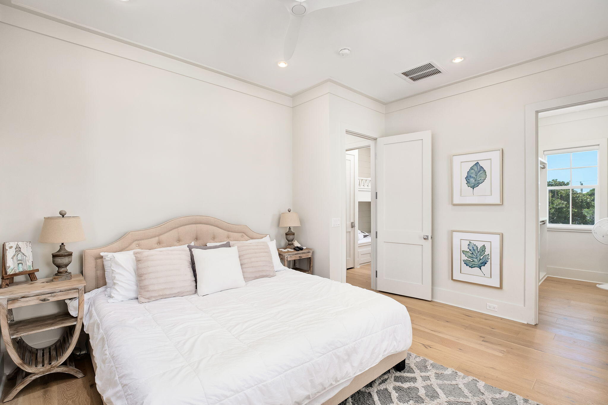 45 Mary Street Santa Rosa Beach, FL 32459 - Photo 16 of 46 a bedroom with a bed and wooden floor