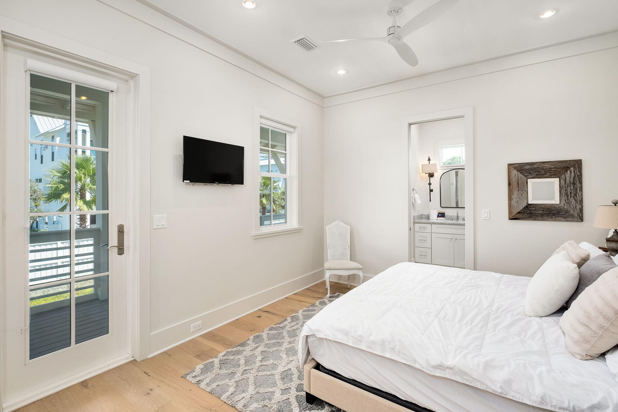 45 Mary Street Santa Rosa Beach, FL 32459 - Photo 17 of 46 a bedroom with a bed and a flat screen tv