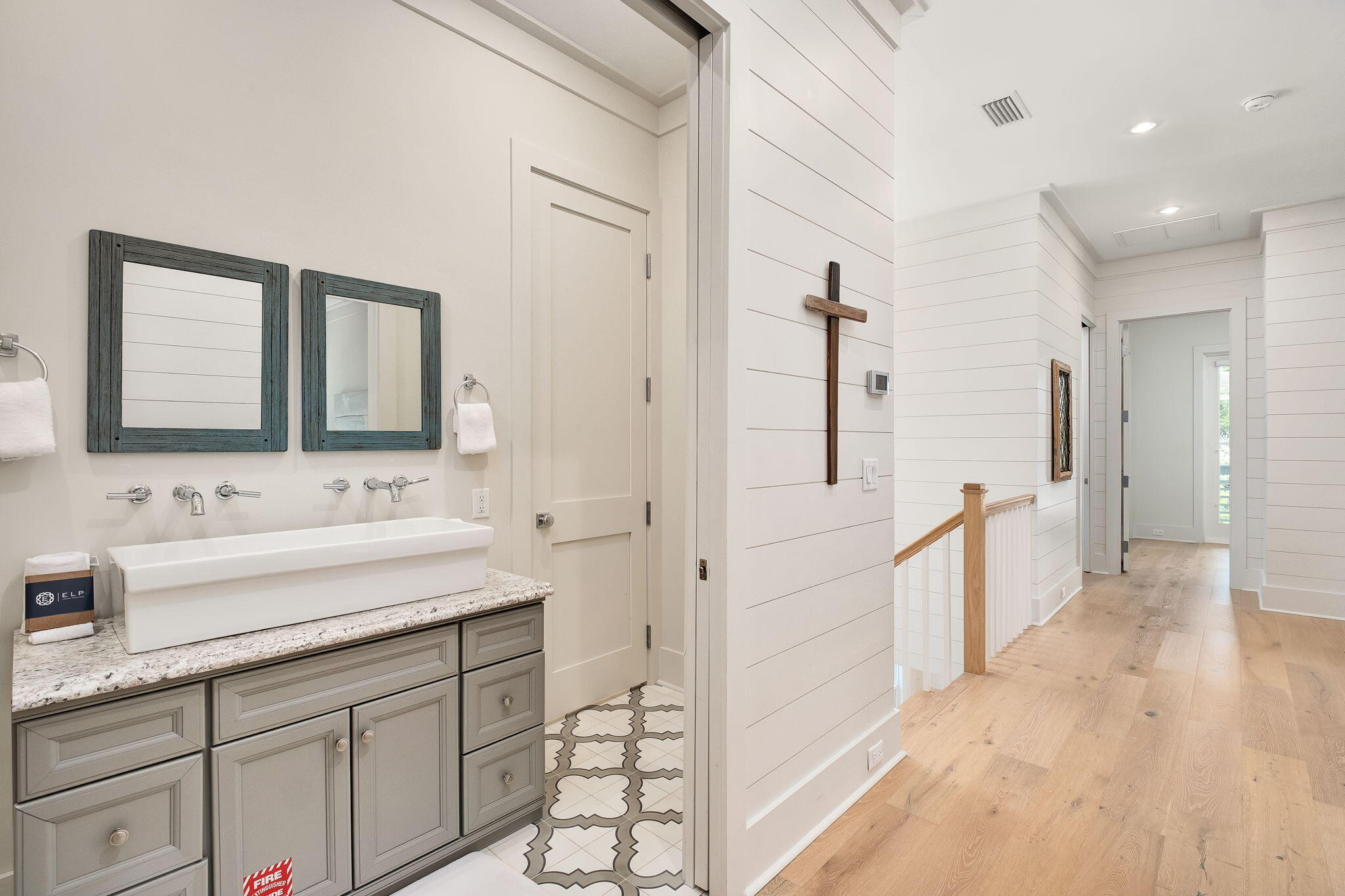 45 Mary Street Santa Rosa Beach, FL 32459 - Photo 23 of 46 a spacious bathroom with a double vanity sink a mirror and shower