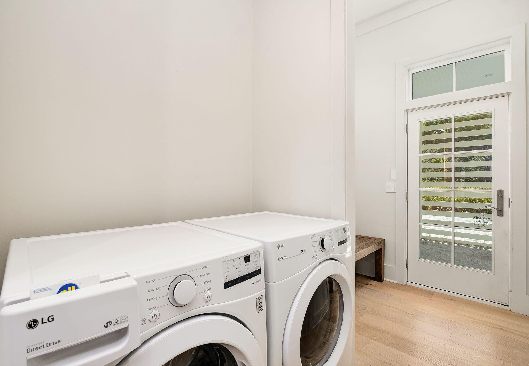 45 Mary Street Santa Rosa Beach, FL 32459 - Photo 29 of 46 a view of washer and dryer with kitchen in the background