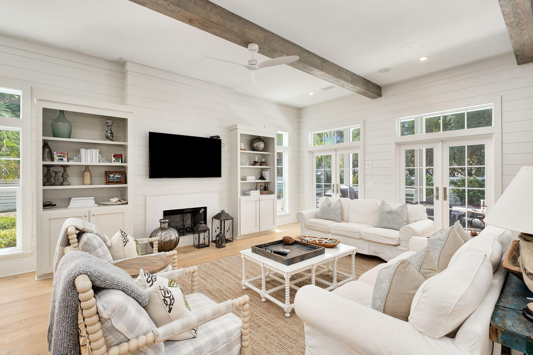 45 Mary Street Santa Rosa Beach, FL 32459 - Photo 3 of 46 a living room with furniture a fireplace and a flat screen tv