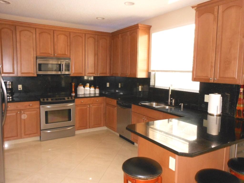 10776 Tea Olive Lane Boca Raton, FL 33498 - Photo 4 of 23 Updated Kitchen with granite counters