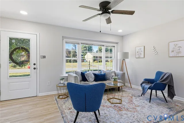a living room with furniture and a window