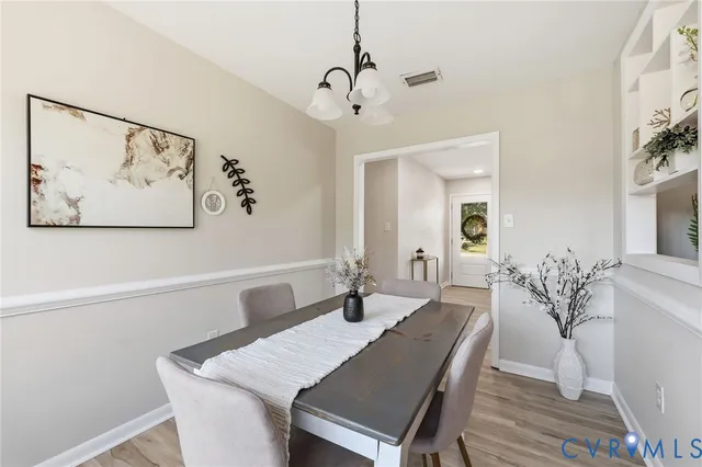 a dining room with a table and chairs