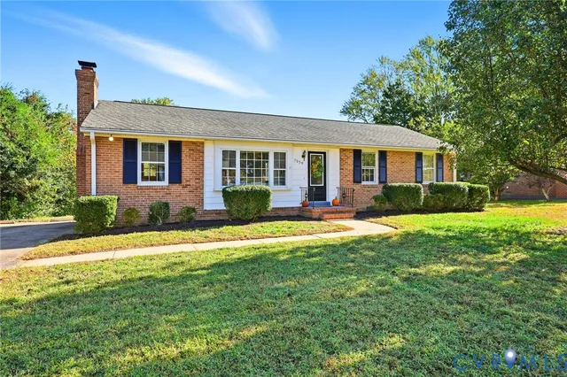 front view of a house with a yard