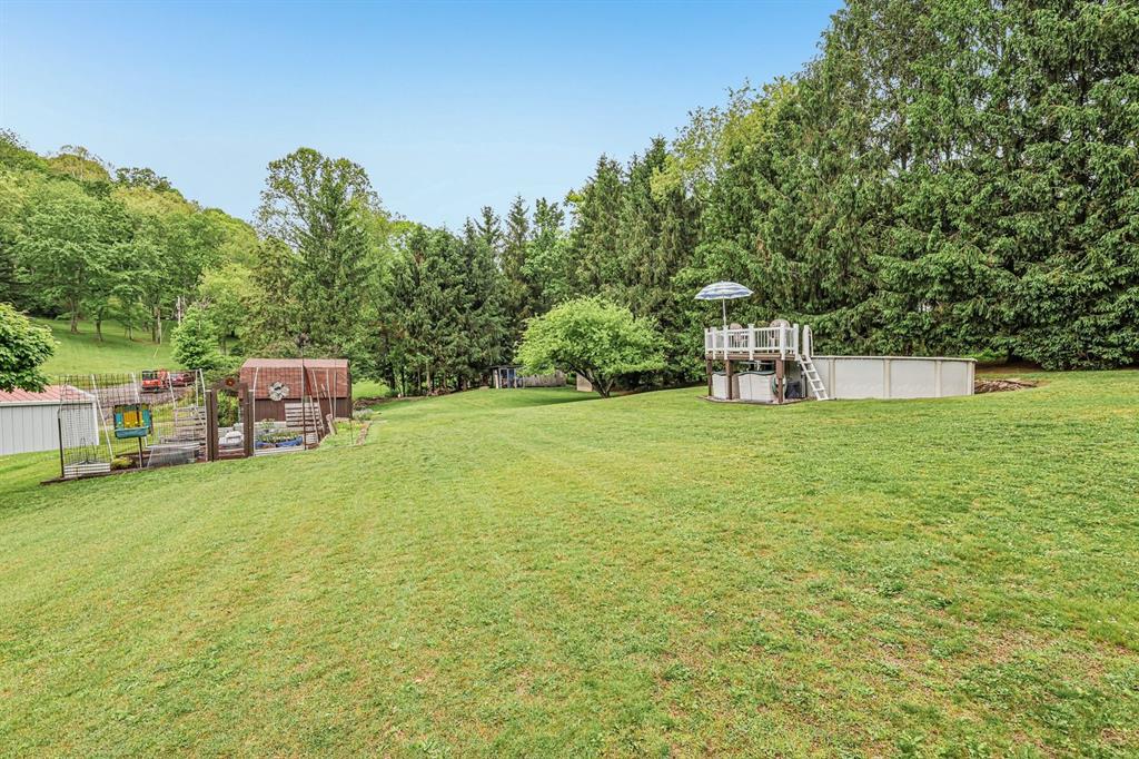 529 Utopia Road Apollo, PA 15613 - Photo 48 of 50 a swimming pool that is in front of the green field