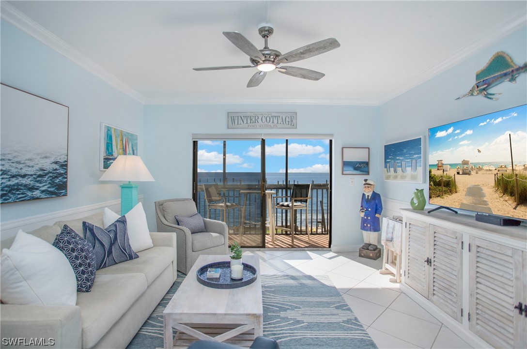 1920 Virginia Avenue, Unit 102 Fort Myers, FL 33901 - Photo 1 of 11 a living room with furniture and a large window