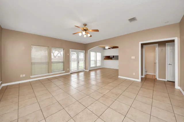 a view of an empty room with a window