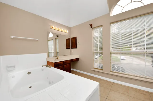 a bathroom with a bathtub and a sink