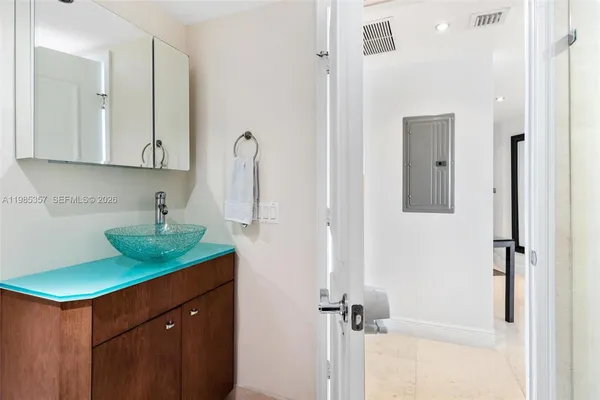 a kitchen with a sink and a refrigerator