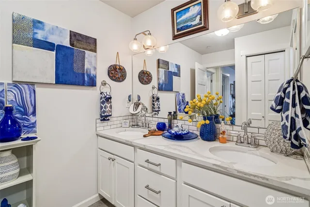 a bathroom with a sink a vanity and a mirror