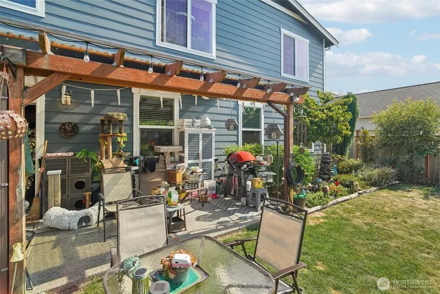 a view of a chairs and table in a patio