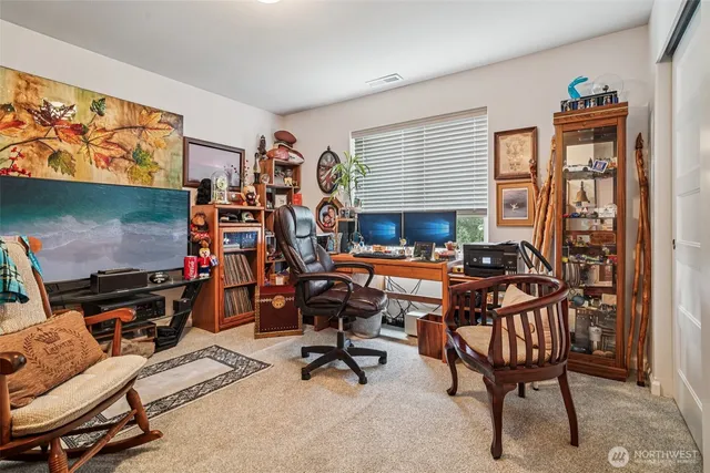 a view of a livingroom with furniture and a window