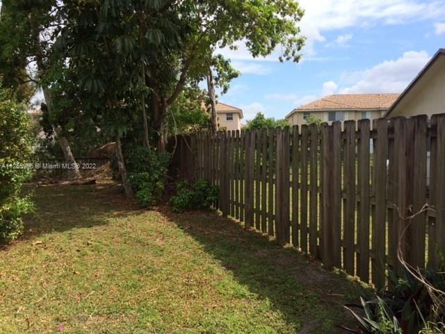 Welleby Sunrise, FL 33351 - Photo 15 of 15 a view of a backyard with pathway