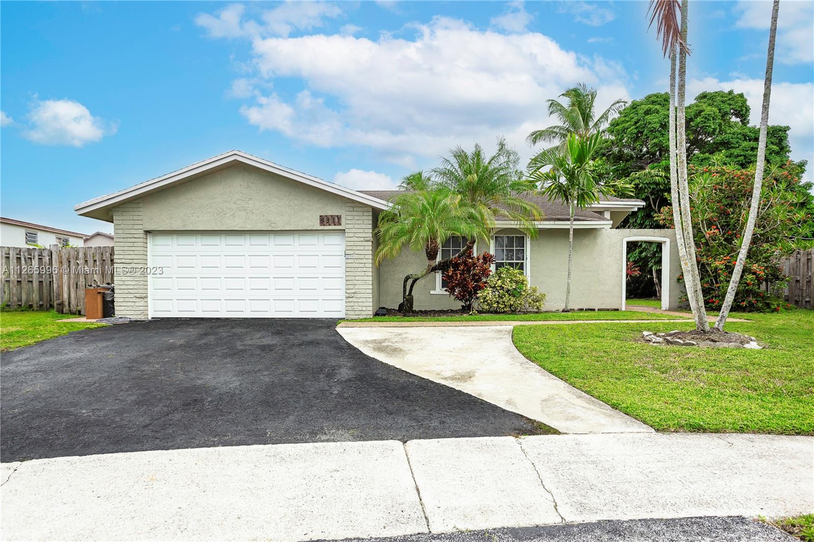 Welleby Sunrise, FL 33351 - Photo 2 of 15 a front view of a house with garden