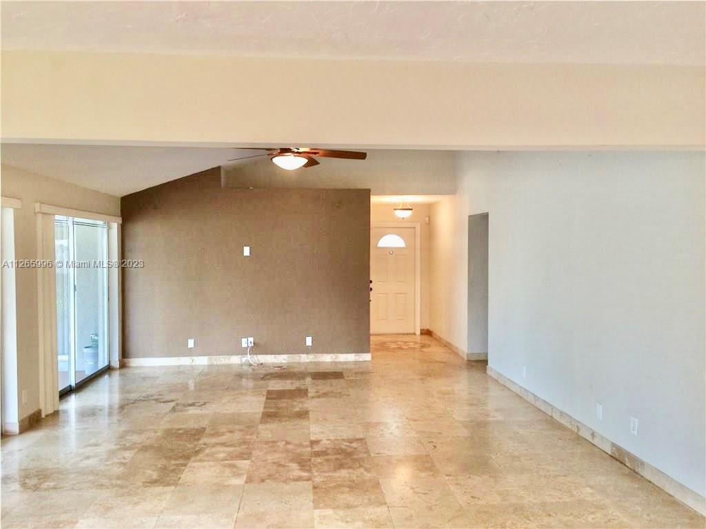 Welleby Sunrise, FL 33351 - Photo 4 of 15 a view of a livingroom with a staircase