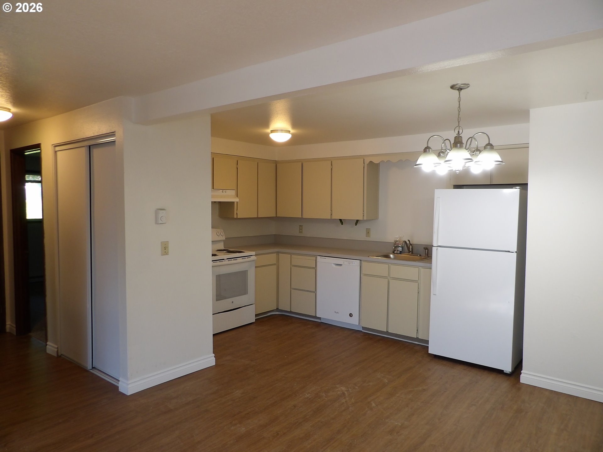 3124 19th Place Forest Grove, OR 97116 - Photo 22 of 31 a kitchen with white cabinets and white appliances
