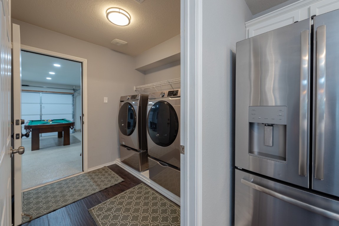 1519 Davis Mountain Loop Cedar Park, TX 78613 - Photo 14 of 39 a view of walk in closet with clothes and shoes