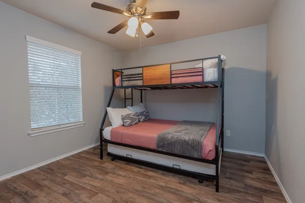 a bedroom with a bed and window