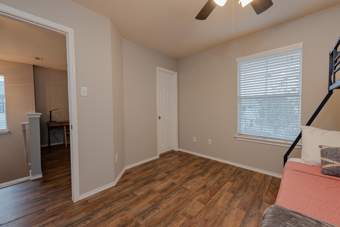 1519 Davis Mountain Loop Cedar Park, TX 78613 - Photo 25 of 39 an empty room with wooden floor cabinet and windows