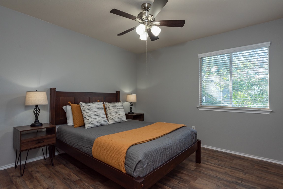1519 Davis Mountain Loop Cedar Park, TX 78613 - Photo 26 of 39 a bedroom with a bed and a lamp