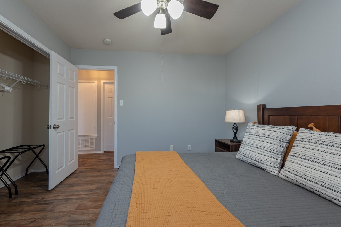 1519 Davis Mountain Loop Cedar Park, TX 78613 - Photo 27 of 39 a bedroom with a bed and a lamp on dresser