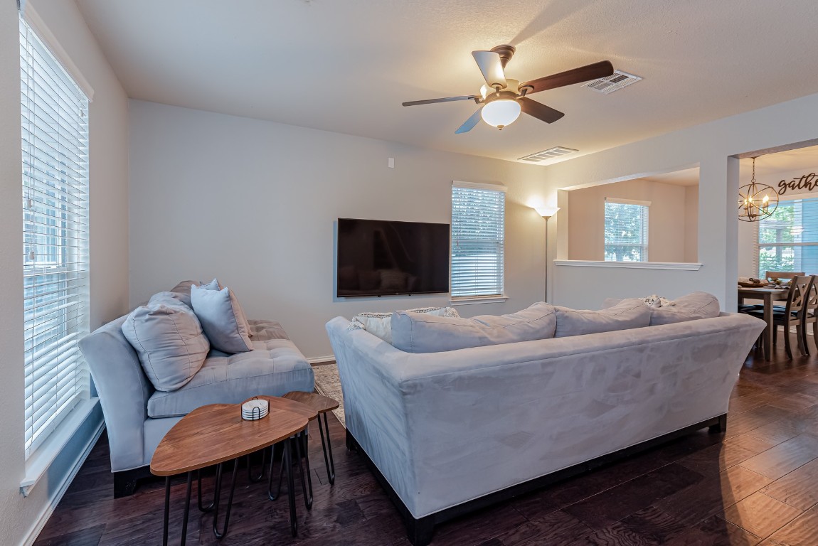 1519 Davis Mountain Loop Cedar Park, TX 78613 - Photo 3 of 39 a living room with furniture and a flat screen tv
