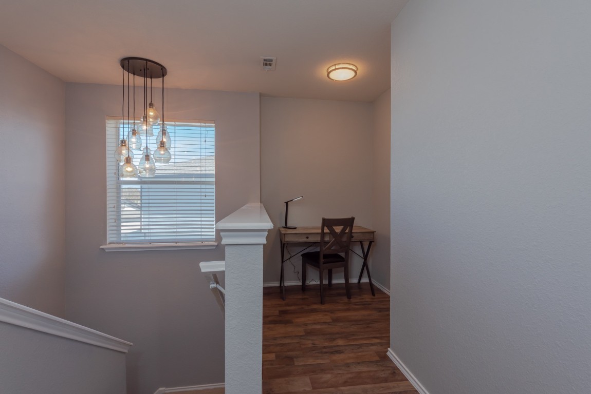 1519 Davis Mountain Loop Cedar Park, TX 78613 - Photo 32 of 39 a view of a dining room with furniture window and wooden floor