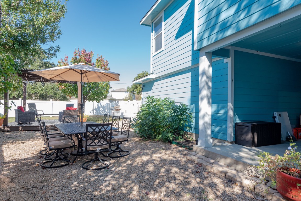1519 Davis Mountain Loop Cedar Park, TX 78613 - Photo 34 of 39 a view of a patio with a table and chairs under an umbrella