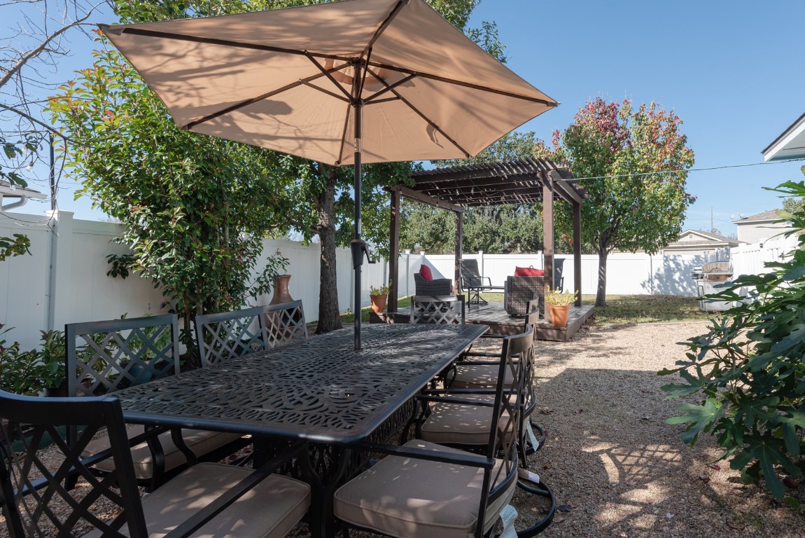 1519 Davis Mountain Loop Cedar Park, TX 78613 - Photo 36 of 39 a view of a table and chairs under an umbrella