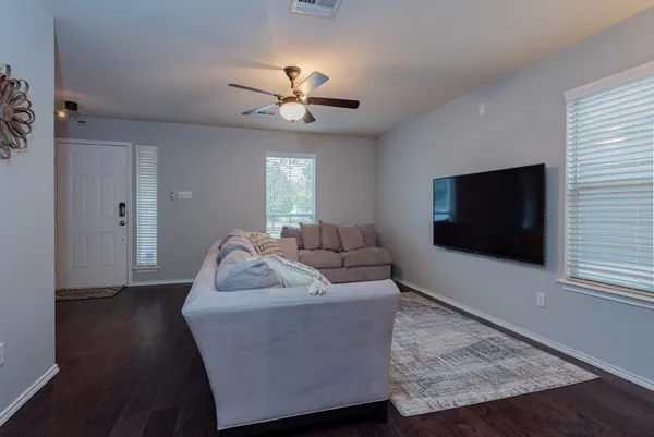 a living room with furniture and a large window